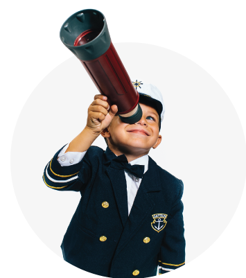 boy holding up a telescope dressed as a boat captain