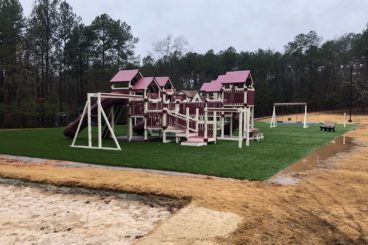 burgundy and white commercial playset with added playhouse additional angle
