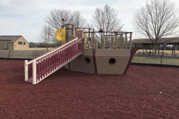 red and yellow boat playground set