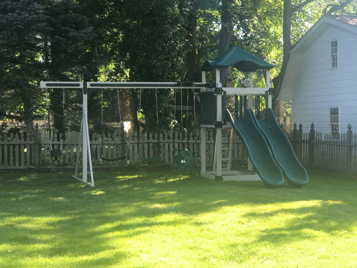 kids vinyl playset with double slide and swing set