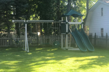 kids vinyl playset with double slide and swing set