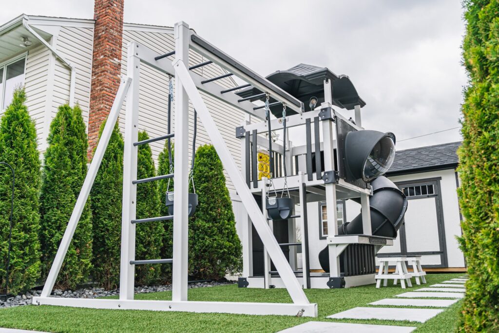 a high-quality vinyl playset equipped with monkey bars, a spiral slide, a tic tac toe play accessory and more