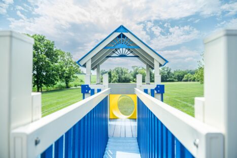 picture of a swing kingdom playset tower from the point of view of a child on the bridge