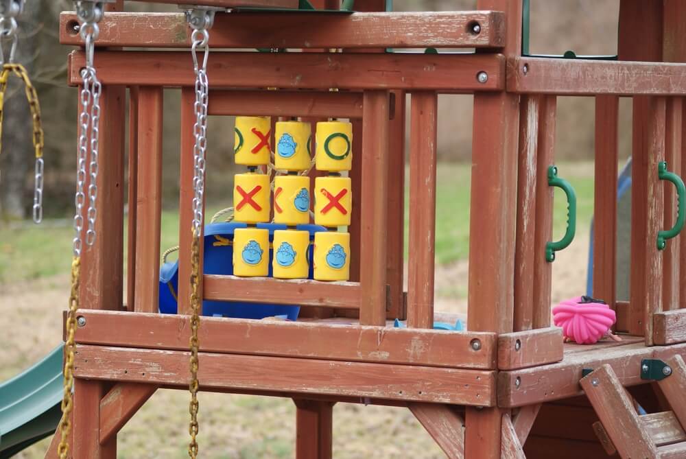 close up of an old, weathered wooden playset