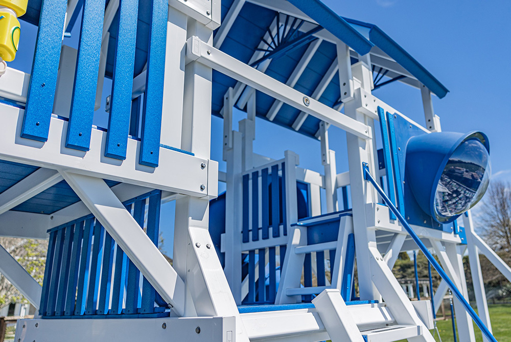 close up of a blue and white vinyl playset from swing kingdom